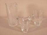 two vases and a glass on the table