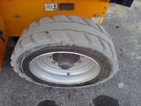 a tire that is sitting on the side of the road