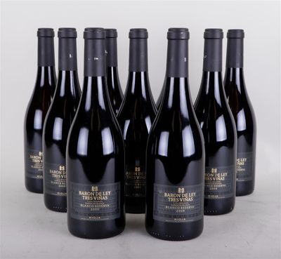 six bottles of wine are lined up in a row on a table