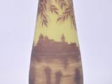 a vase that has a picture of a tree on it