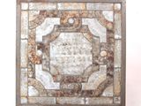 an image of a square tile with a decorative design on it