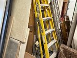 a ladder that is leaning against a wall in a garage