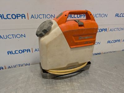 a close up of a floor scruber on a table in front of a wall