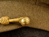 a close up of a hat with a tie on it