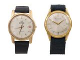 an image of a couple of watches sitting side by side on a white surface