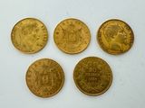 four gold sovereigns, one of which is a sovereign and one of which is a sovereign