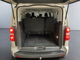 a white van with its back doors open and the back seats down