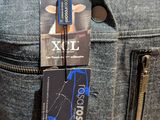 a luggage tag attached to the back of a suit jacket
