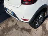 a white car that is parked in a parking lot