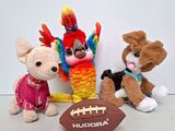three stuffed animals sitting next to each other on a table