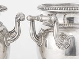 deux vases en argent, munis chacun d'une anse