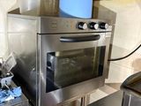 a kitchen with a stove, oven, and other appliances in it