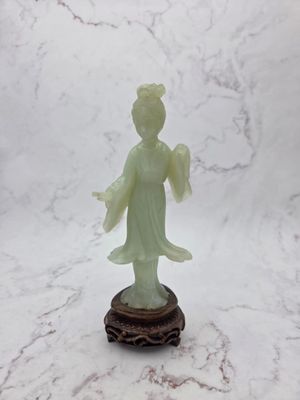 chinese jade figurine of a lady holding a flower