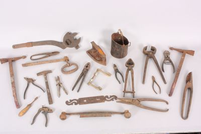 a lot of old tools that are on a table