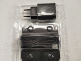 a plastic box with a couple of plugs inside of it
