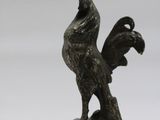 bronze figurine of a rooster on a marble base
