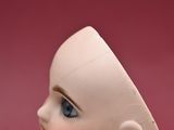 a small doll that is sitting on top of a table