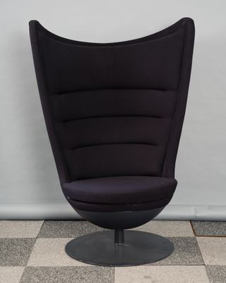 an image of a black chair sitting on top of a checkered floor