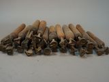 an image of a pile of wood dows on a white surface
