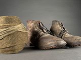 a pair of shoes that are tied up with a rope