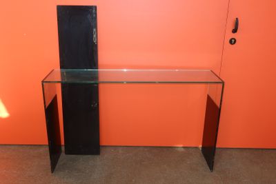 an image of a glass desk with a computer on it