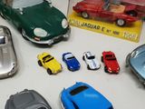 a lot of toy cars that are on a table