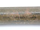 a small metal tube with a message on it