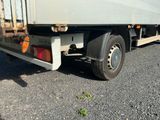 a white truck that is parked on the side of the road