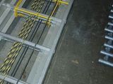 a ladder that is sitting on the floor in a warehouse