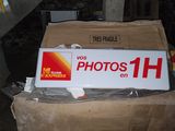 a sign that is sitting on top of a cardboard box