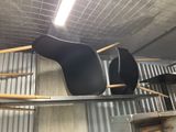two chairs that are sitting on a shelf in a room