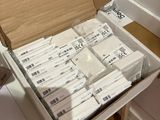 a box full of packages sitting on top of a counter
