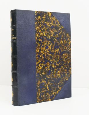 an old book with a blue cover and gold foil on it
