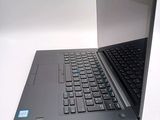 a laptop computer sitting on a table with a white background