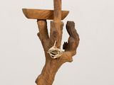 a wooden table with a bird on top of it