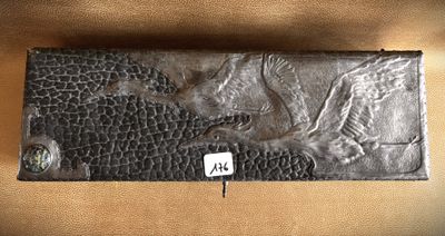 an image of a close up of a wallet with a bird on it