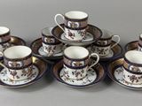 six cups and saucers sitting on a table