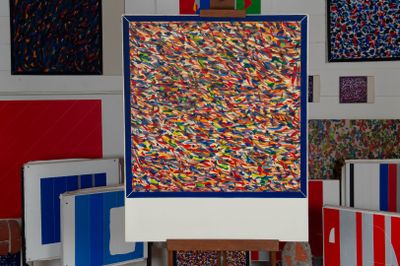 a picture of a painting on a easel in a room