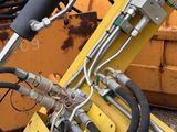a close up of a machine with a hose attached to it