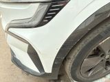 a close up of the front bumper of a white car