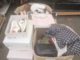 many boxes of clothes and shoes on the ground