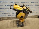a close up of a machine on a stand in front of a wall