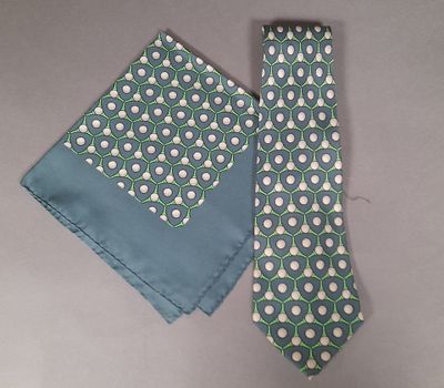 a tie and a pocket square on a table