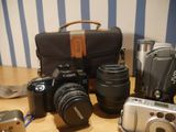 many different types of cameras sitting on a table