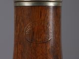 a close up of a wooden object with a metal lid