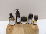 a wooden tray with a lot of skin care products on it