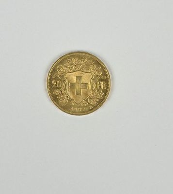 l'image d'une pièce d'or posée sur une surface blanche