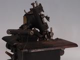 an old sewing machine sitting on top of a table