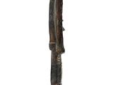 statue of a man with a knife in his hand on a wooden base