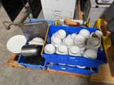 a lot of plates and pans that are on a pallet